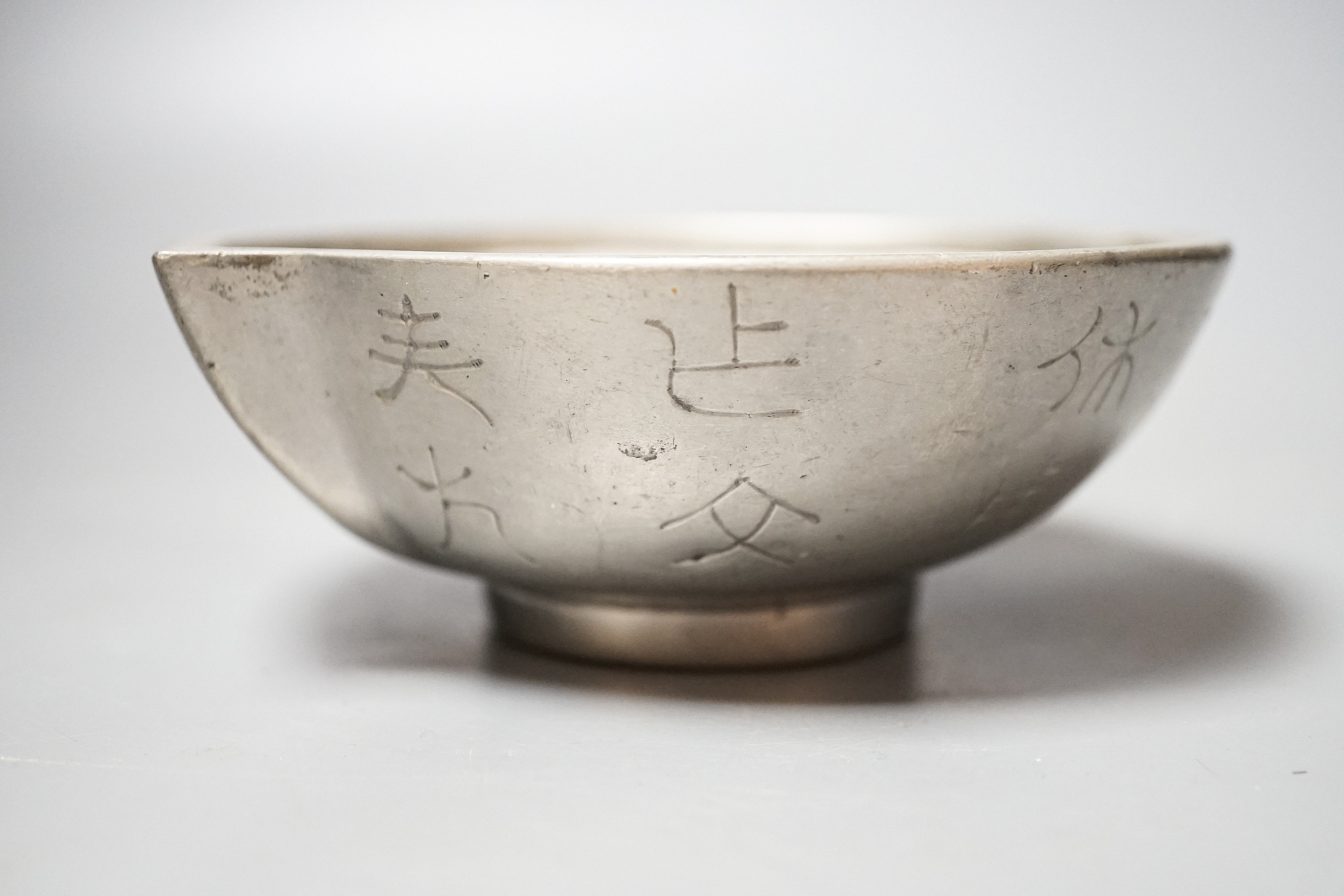 A Chinese Yixing pottery and pewter mounted peach shaped cup, late 19th century, length 13cm
